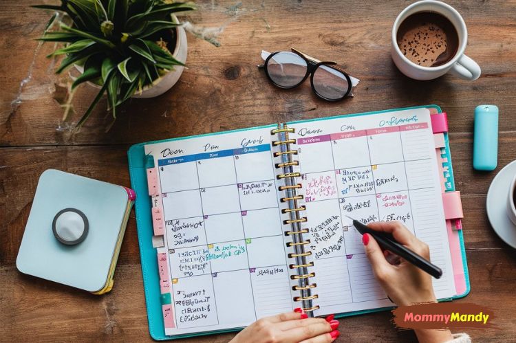 a mother using a colorful planner to schedule her day
